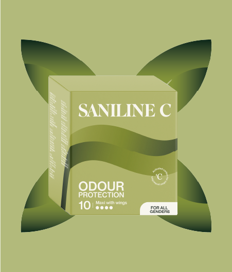 Grön förpackning av Saniline C maxi with wings, med texten 'Odour Protection' och 'For all genders'. Produkten är placerad mot en ljusgrön bakgrund med ett bladliknande grafiskt mönster bakom förpackningen.